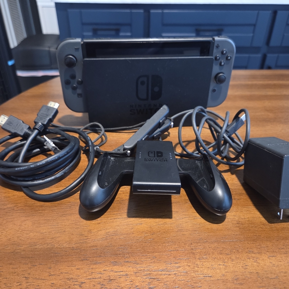 Used Nintendo Switch Console- Includes Joycon, Grip, USB Cord, & Charger